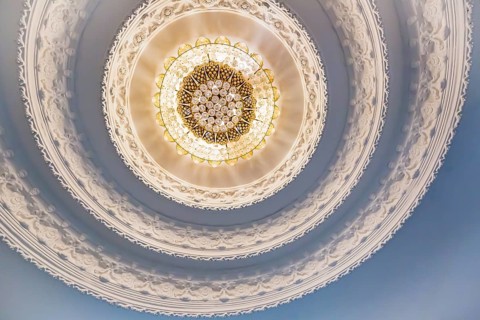 Ornate recessed light fixtures in the ceiling inside the Guan Yin (Goddess of Mercy) statue at Wat