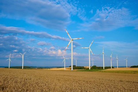 Several wind turbines on a field under blue sky and clouds, summer, Höhefeld, Wertheim,
