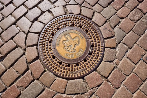 Manhole cover, 350 years of the Peace of Westphalia, 1648 to 1998, golden, cobblestones, biblical
