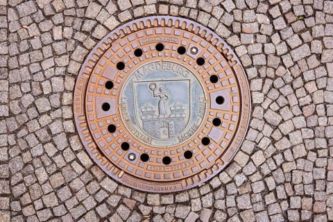 Manhole covers, paving stones, Magdeburg, state capital, independent city, Saxony-Anhalt, Germany,