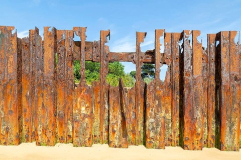Old rusty broken steel sheet piling sea wall coastal defence, River Deben, Bawdsey, Suffolk,