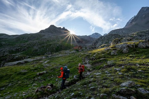 Mountaineers on a hiking trail, mountain hut Elberfelderhütte in front of a rocky mountain