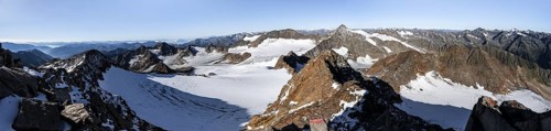 Mountain panorama at Wilder Freiger summit, picturesque high mountain landscape with snow, view of