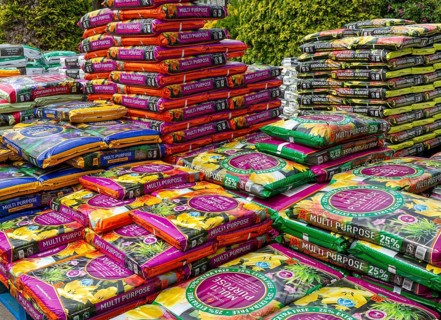 Multi Purpose compost bags stacked up at Lowden garden centre, Wiltshire, England, UK