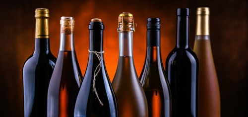 Composition with bottles of different sorts of wine