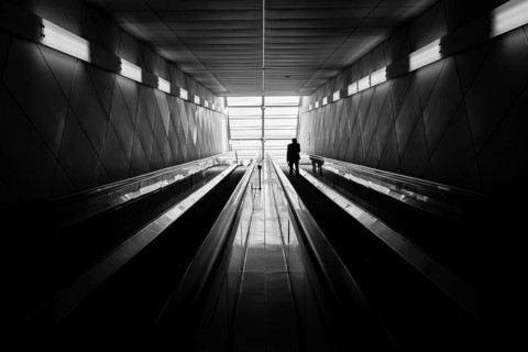 A train passenger exits a subway station in Seoul, Republic of Korea