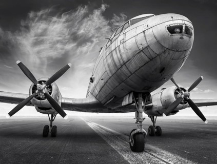 historical airplane on a runway is waiting for take off