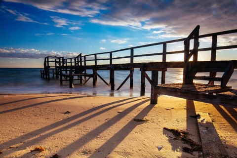 Piers near Millionaire's Walk at Point King Beach on a cool winter's morning at sunrise on the
