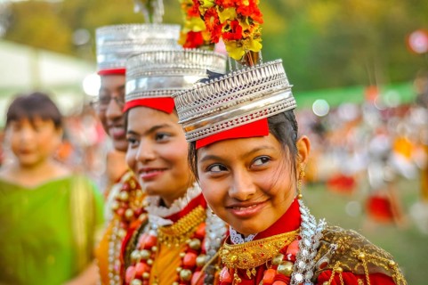 Shillong, Meghalaya, circa April 2012: Smiling girls in traditional costumes with large beads and