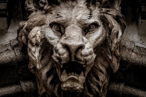 Italy, Turin. Made of stone and located on a marble arch, aroud 300 years old. Fallen angel in the