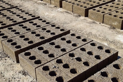 Freshly made cinder blocks on a concrete pad
