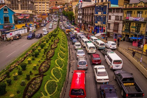 View from a bridge showing a street full of cars stuck in a traffic jam on the city highway in rush