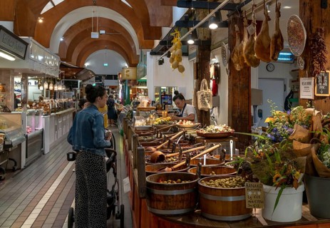 Cork, Ireland, 16 August, 2022: customers buying food at a market stall with Spanish delicacies and