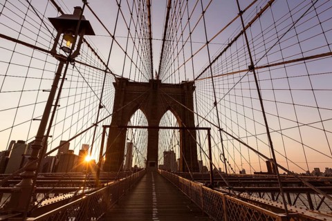 Brooklyn Bridge sunset with Manhattan skyline of New York City USA