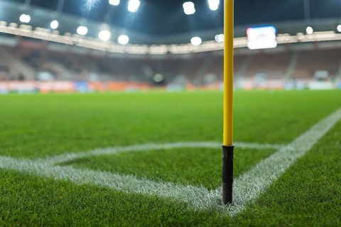 Close up flag's pole in the corner of soccer pitch