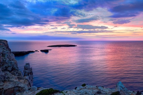 Menorca sunset in Cap de Caballeria cape at Balearic Islands es Mercadal
