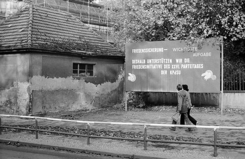 08.10.1981 GDR East Berlin district of Prenzlauer Berg. Agitation poster on a damaged house in