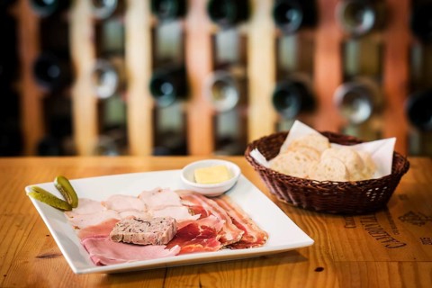 Traditional french charcuterie and pate starter platter with bread