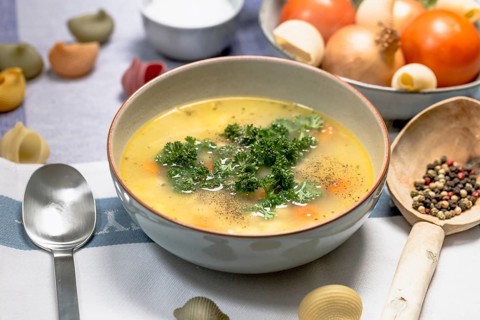 Chicken noodle soup with carrots and parsley