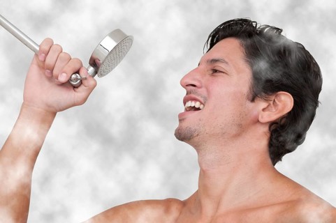 Young man performing a concert by singing in the shower