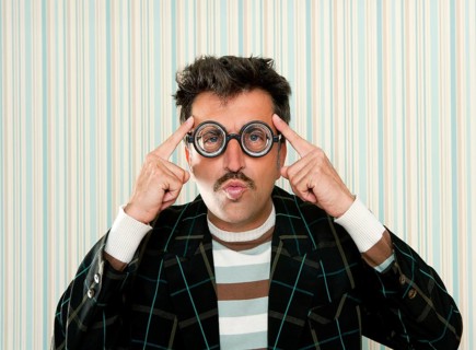 Nerd silly myopic man with glasses thinking doing funny gesture with retro mustache