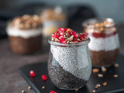 Healthy breakfast concept and idea - two colors chia pudding with organic raw pomegranate, almond