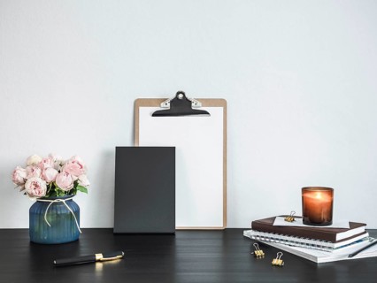 Empty chalkboard on table. Home office concept or mockup. Chalkboard mock up portrait format, copy