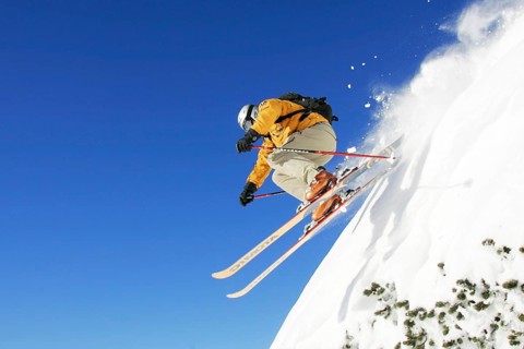 Skiers in action, skiing down the slope