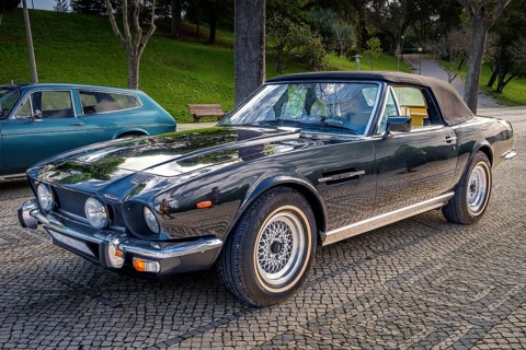 Lisbon, Portugal, Jan 20, 2024: Classic brown Aston Martin V8 Volante grand tourer parked on a