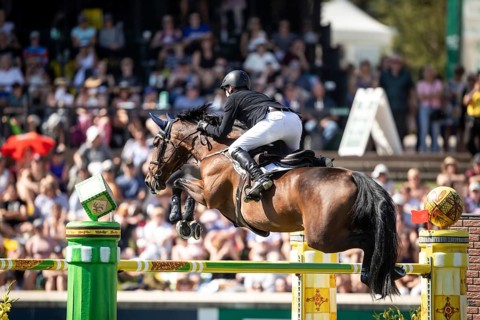 Daniel Coyle of Ireland and riding Legacy compete in the first round of the 1.60m CPKC