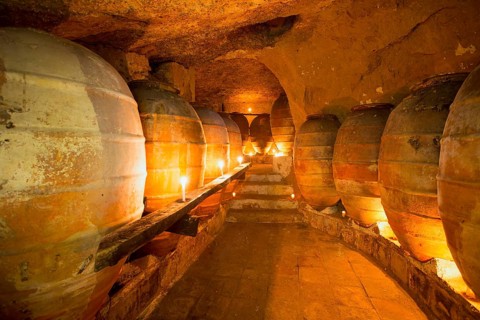 Antique winery in Spain with clay vessels terracotta amphora pots Mediterranean tradition with