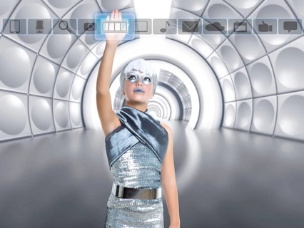 Futuristic kid girl in silver touching finger icons on glass transparent holographic screen