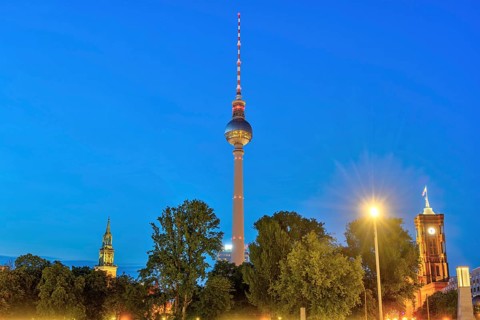 The famous television tower with the towers of St Mary's Church and the town hall in Berlin at