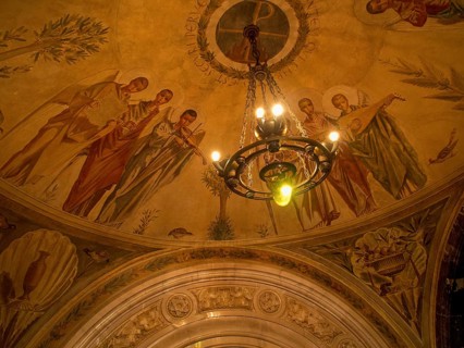 Ceiling frescoes with religious motifs and ornate details as well as lighting, montserrat, spain