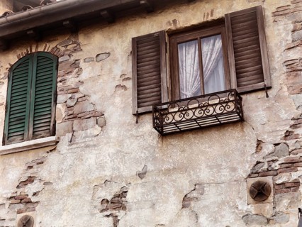 Old rustic house windows, antique architecture in Venetian style