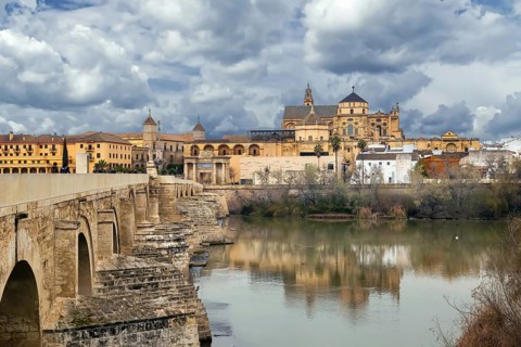 View of Mosque Cathedral of Cordoba from Roman Bridge, Spain, Europe
