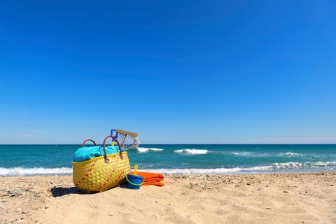 Beach bag and toys for summer vacation