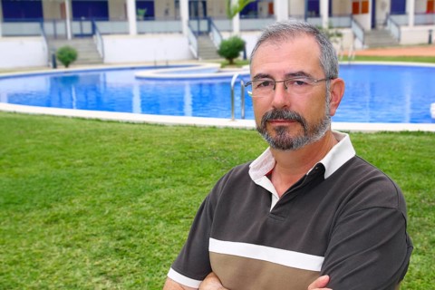 Senior retired man glasses relax on vacation garden pool