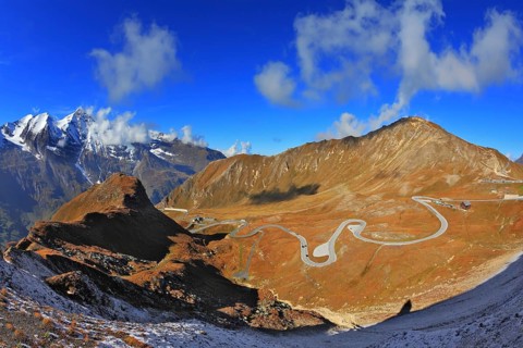Austrian Alps. Excursion to the picturesque panoramic way Grossgloknershtrasse. Sunny day in early