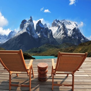 Comfortable wooden chair - chaise lounges stand on a wooden platform. Lookout is arranged in front