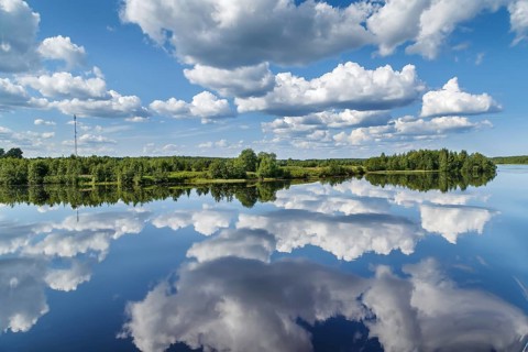 Landscape with a symmetrical reflection on the Vyg river (part of the White Sea-Baltic Canal),