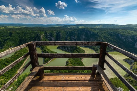Viewpoint of meanders at rocky river Uvac gorge on sunny day, southwest Serbia