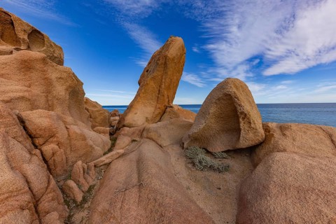 Coastal landscape with bizarre red rocks and sea view, Spiaggia di Cala E'Luas, Ogliastra,