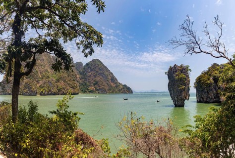 A colorful picture of the beautiful landscape of the James Bond Island and its iconic islet