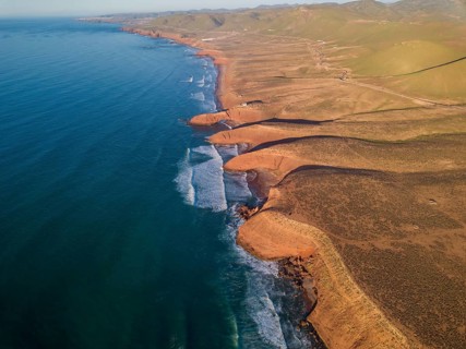Aerial view on Legzira beach with arched rocks on the Atlantic coast at sunset in Morocco