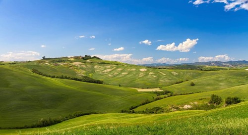 Hilly landscape with blue skies in Crete Senesi, Asciano, Siena, Italy, Europe