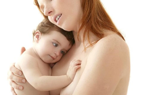 Nude baby and mother portrait hug playing white background