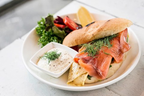 Scandinavian healthy fresh smoked salmon sandwich with egg and sour cream set meal