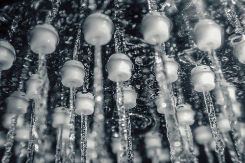 Shower head with running water closeup