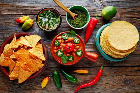 Frijoles charros mexican beans with chili pepper sides and tortillas